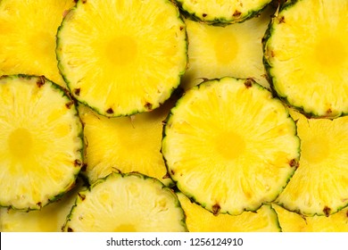 Pineapple juicy yellow slices background. Top view. - Powered by Shutterstock