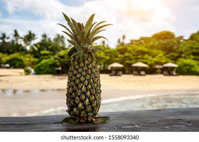 Pineapple on a beach background