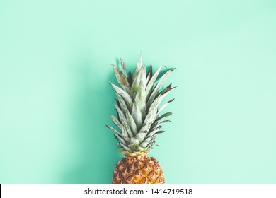 Pineapple on mint background. Summer concept. Flat lay, top view Arkivfotografi