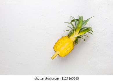 Pineapple on white wall background.