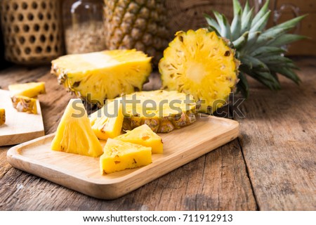 pineapple on the wooden texture background