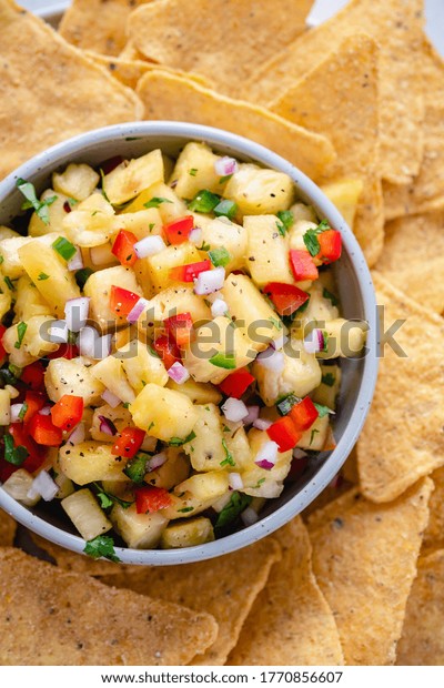 Pineapple salsa with\
nachos, summer party\
food
