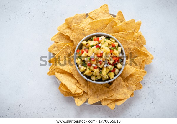 Pineapple salsa with\
nachos, summer party\
food