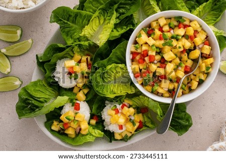 Pineapple salsa wraps served with lettuce and white rice, healthy appetizer or snack idea