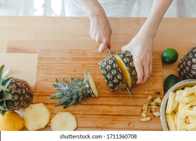 Pineapple Sliced By A Girl On The Kitchen Counter. Pineapples Contain A Group Of Digestive Enzymes As Bromelain, Function As Proteases, Break Down Protein Molecules Into Amino Acids And Small Peptides