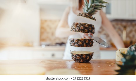 Pineapple Sliced By A Girl On The Kitchen Counter. Pineapples Contain A Group Of Digestive Enzymes As Bromelain, Function As Proteases, Break Down Protein Molecules Into Amino Acids And Small Peptides