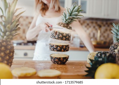 Pineapple Sliced By A Girl On The Kitchen Counter. Pineapples Contain A Group Of Digestive Enzymes As Bromelain, Function As Proteases, Break Down Protein Molecules Into Amino Acids And Small Peptides