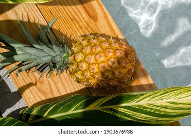 
A pineapple sunbathing by the pool