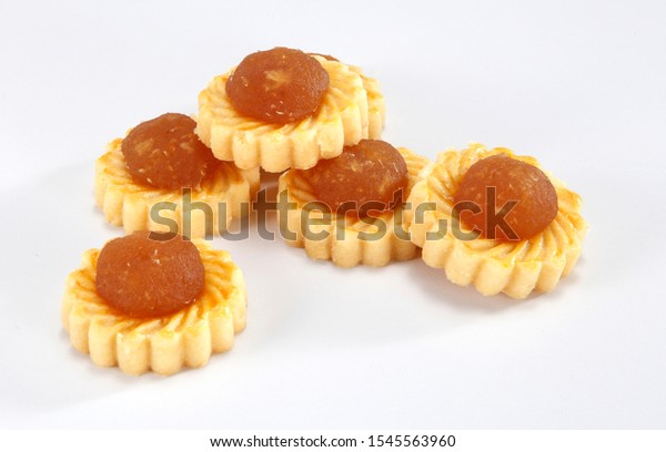 Pineapple tarts or nanas tart are\
small, bite-size pastries filled or topped with pineapple\
jam