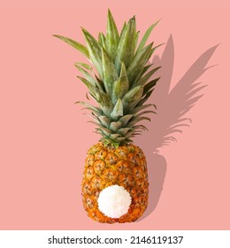 Pineapple With White Bunny Tail On Pastel Pink Background. Easter Minimal Concept. Creative Easter Idea. Tropical Fruit Decoration.