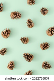 Pinecone Pattern On A Bright Green Background. Minimal Autumn Nature Arrangement. Holiday Season Idea. Flat Lay.