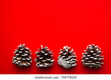 Pinecones on red background