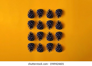 Pinecones pattern isolated on yellow background