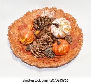 Pinecones And Pumpkins In Orange Paper Mache Bowl