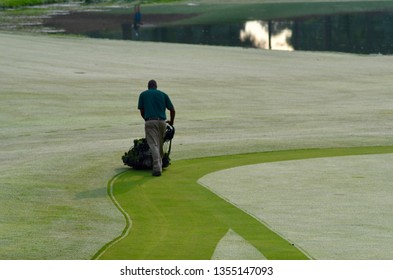 Pinehurst, NC, United States- 07/04/2017- A Worker At The Pinehurst Country Club Mows The Green Early One Morning On The 14th Hole Of Pinehurst No. 4. 