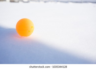 Ping Pong Ball On The Snow. Table Tennis, Also Known As Ping Pong, Is A Sport In Which Two Or Four Players Hit A Lightweight Ball Back And Forth Across A Table Using Small Bats.