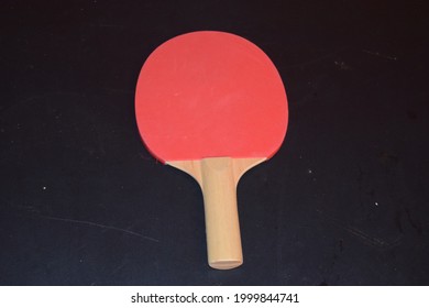 Ping Pong Paddle On A Table