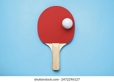 Ping pong racket with the ball for playing table tennis on a colored background - Powered by Shutterstock