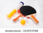 Ping pong rackets with package of balls.