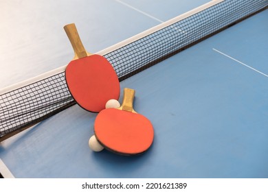 Ping pong table, rackets and balls