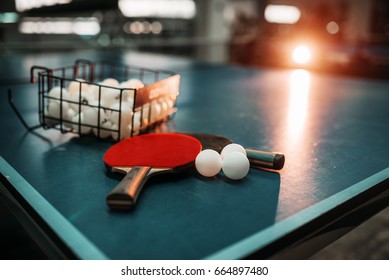 Ping pong table, rackets and balls in a sport hall