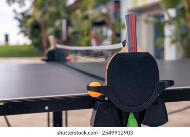 Ping pong table set up in a hotel garden in Turkiye on a sunny day - Powered by Shutterstock