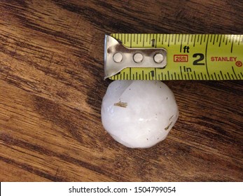 Ping-pong to golf ball sized hail with measuring tape to verify size, taken from a severe weather hail storm in North Texas.  April 2018