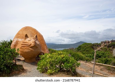 Pingtung, Taiwan-May 1, 2022: The cat-shaped statue is located in Maobitou Park, in Pingtung, Taiwan.