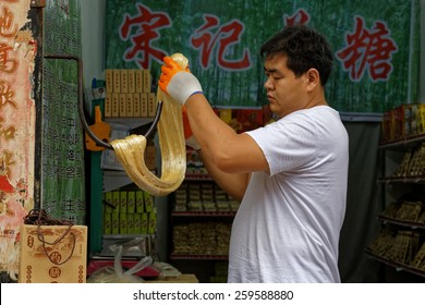 Pingyao,China - September 20,2013 : Unidentified Sugar Candy Confectioner Produce Candies In A Traditional (old Fashioned ) Way In Pingyao,China