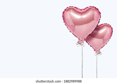 Pink air balloons heart shape on a white background. Concept wedding, valentines day, photo zone, lovers. Banner. Flat lay, top view - Powered by Shutterstock