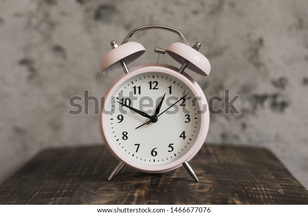 Pink Alarm Clock On Wooden Desk Stock Photo Edit Now 1466677076