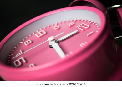 Pink Alarm Clock Setting At Noon Or Midnight. Time Conceptual 