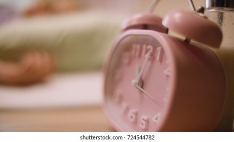 Pink Alarm Clock. Pink Clock Standing On The Nightstand