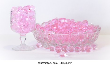 Pink aroma beads in the glass and a small glass dish