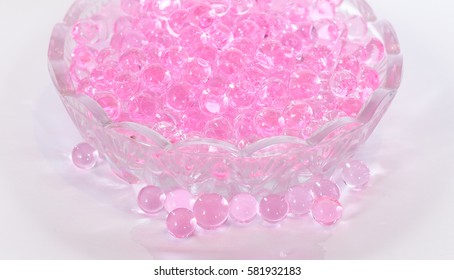 Pink aroma beads in a small glass dish for the jam