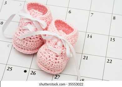 Pink Baby Booties On A Calendar Background, Baby Due Date