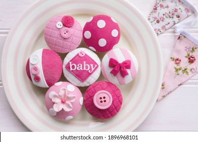 Pink baby shower cupcakes for a little girl