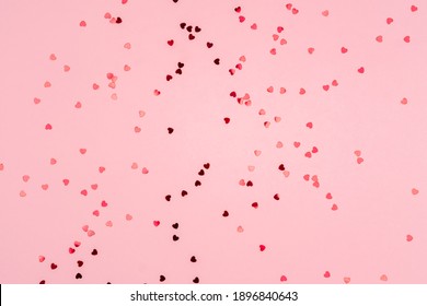 Pink background with glitter hearts for valentine's day. Beautiful wrapping paper or background for a postcard. Place for text, banner for website - Shutterstock ID 1896840643