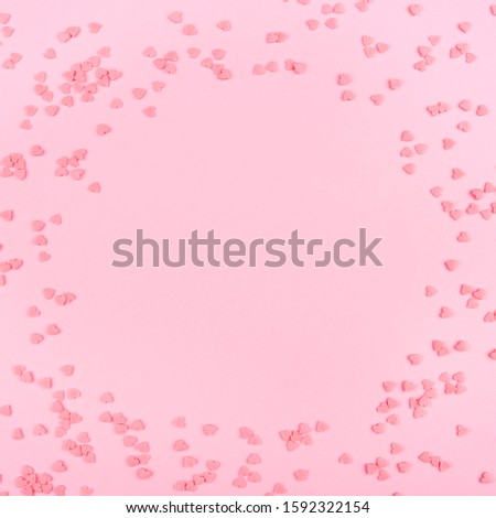 Pink background with tiny hearts. Valentine's day concept. Top view.