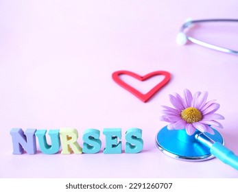 A pink background with the word nurses a red heart and a stethoscope - Powered by Shutterstock