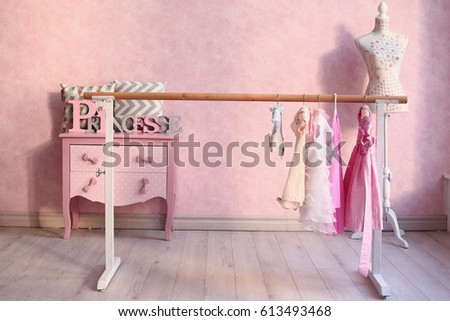 pink ballet lesson class hall interior with dresses and chest drawer