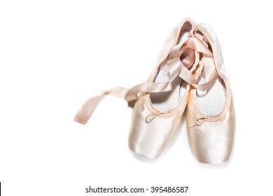 Pink ballet shoes isolated on white background