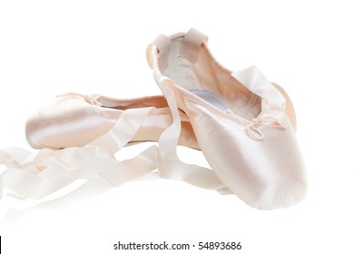 Pink Ballet Shoes Isolated On A White Background, Focus On The Front Shoe.