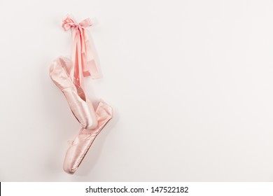 Pink Ballet shoes on white background.