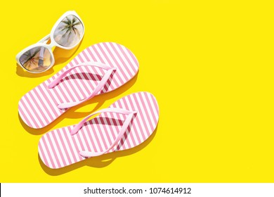 Pink Beach Flip Flop On Yellow Background