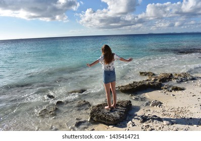 Pink Beach Girl On Rock Bonaire