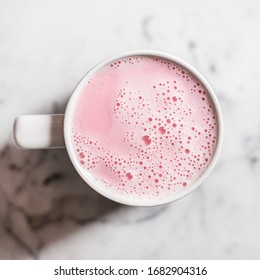 Pink Beetroot Tea Latte on Marble Close Up