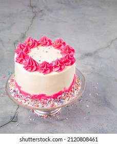 Pink Birthday Cake With Buttercream Icing And Sprinkles