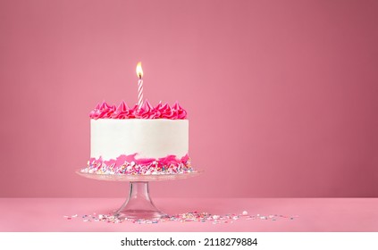 Pink Birthday Cake with Candle on pink background - Powered by Shutterstock