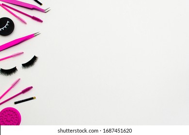 Pink And Black Beauty Salon And Lash Artist Tools And Treatment Products In A Left Hand Side Lay Out Creating A Frame On A White Background